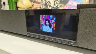 Cambridge Audio Evo One all-in-one system showing display and Bjork album artwork