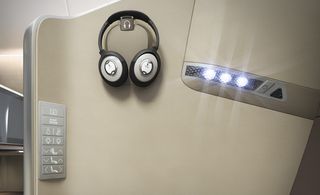 Interior of airplane with headset and LED lighting