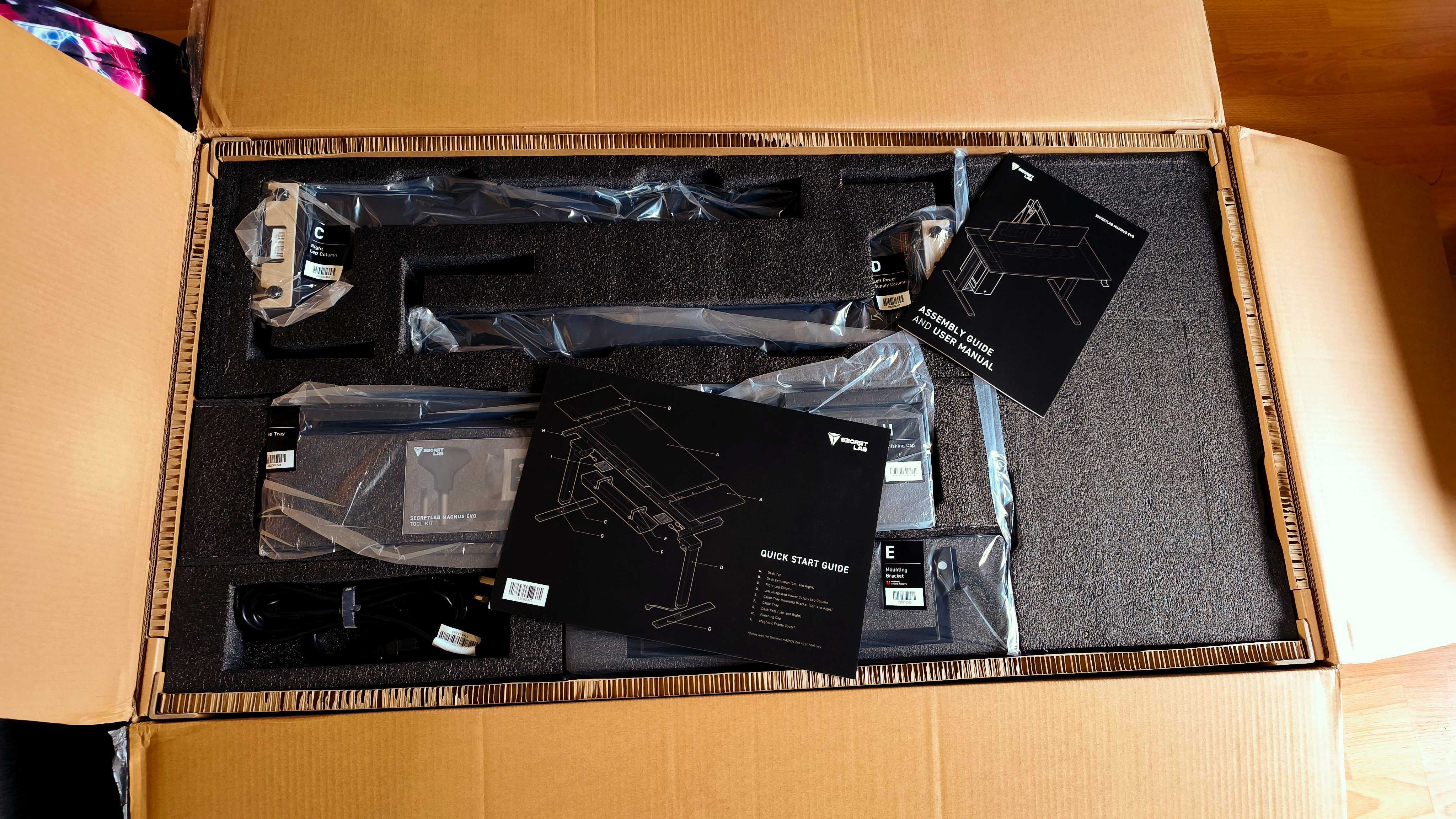 An unassembled Secretlab Magnus Evo desk in its box