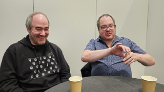 Tarn and Zach Adams laugh during an interview at GDC 2024.