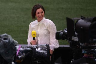 BBC broadcaster Eilidh Barbour reports from the pitch during the UEFA EURO 2020 round of 16 football match between Italy and Austria at Wembley Stadium in London on June 26, 2021. (Photo by Laurence Griffiths / POOL / AFP