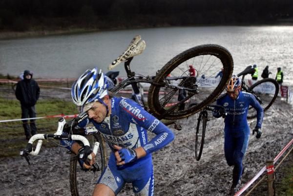 Niels Albert and Sven Nys climb away from the water in Gieten in 2007