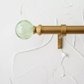 brass curtain rod with jade glass orb endcaps