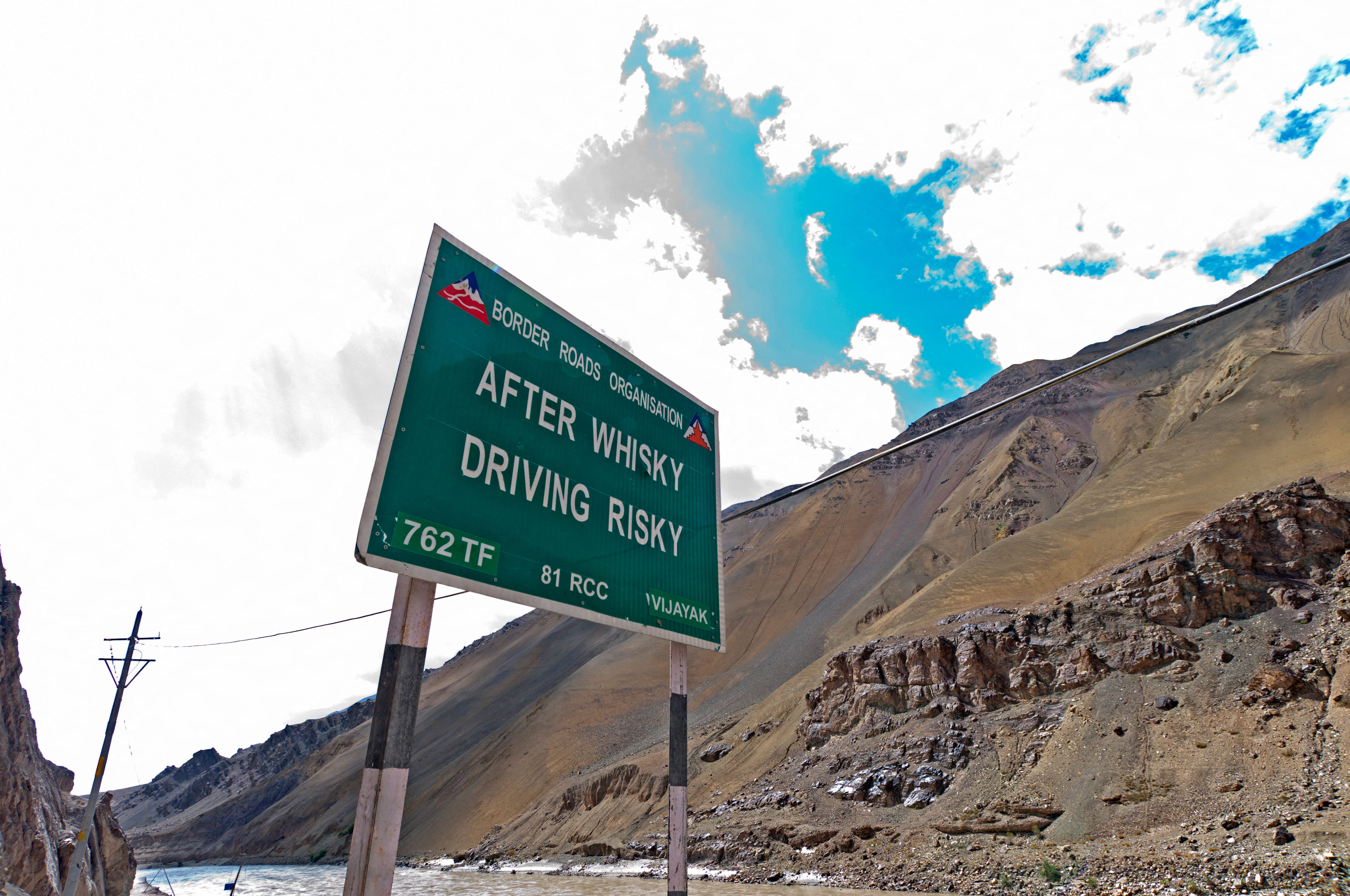 Humorous cautionary road sign: After Whisky Driving Risky on the Leh-Manali Highway Ladakh, India
