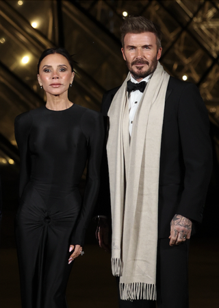 Victoria and David Beckham look elegant in matching black looks as they head to the Grand Gala at the Louvre Museum in Paris, France during Paris Fashion Week