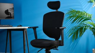 A black Boulies OP300 ergonomic office chair
