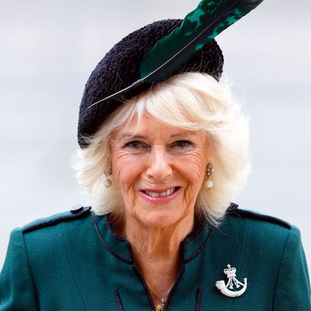 Queen Camilla in a green coat and hat