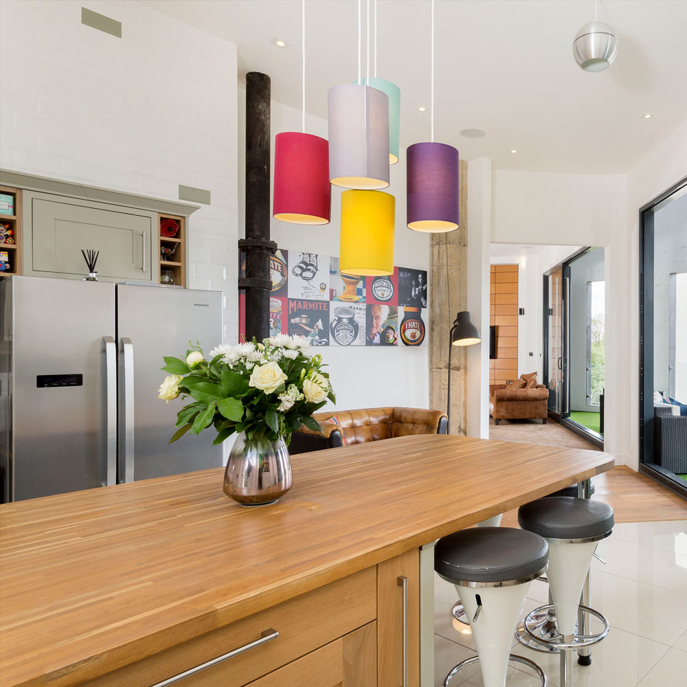 Kitchen with wooden table and refrigerator