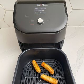 Instant Vortex Plus 6-in-1 Air Fryer with fried sausages