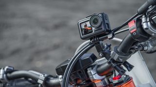 The DJI Osmo Action camera mounted to the handlebars of a motorbike