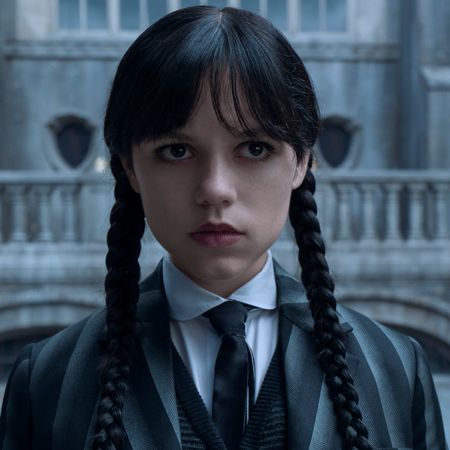 jenna ortega with wednesday's classic braids and nevermore uniform outside of school in season 2