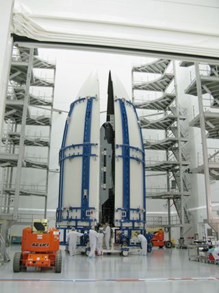 The second Boeing X-37B Orbital Test Vehicle, built for the U.S. Air Force, is shown here during encapsulation within the United Launch Alliance Atlas 5 rocket's 5-meter fairing at Astrotech in Titusville, Fla., on Feb. 8, 2011. The Air Force launched the