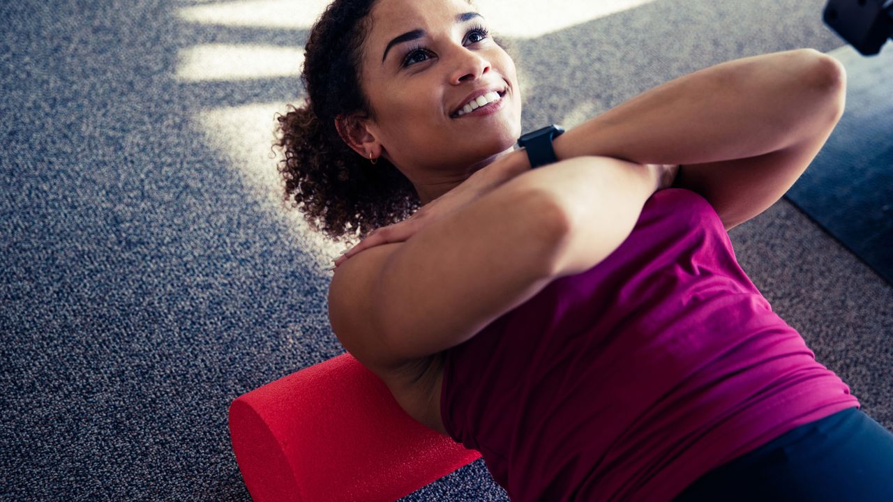 Woman using a foam roller