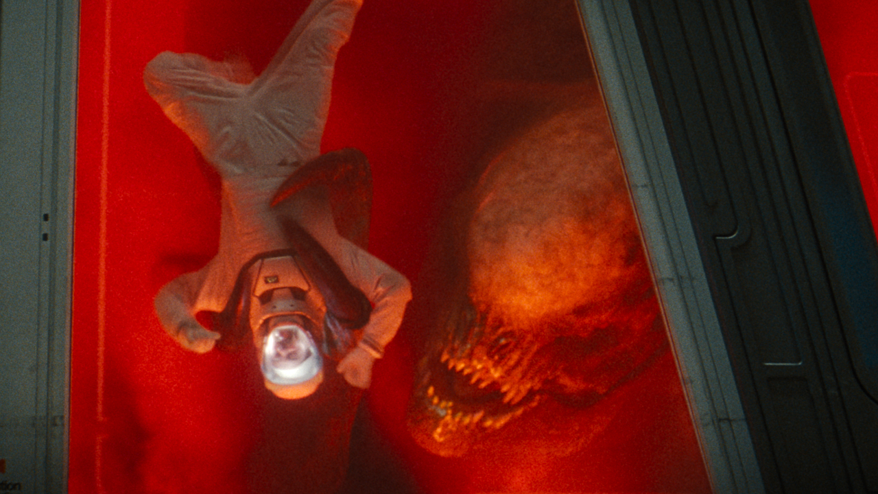The Distortus Rex holds an upside down technician against a window in Jurassic World Rebirth.