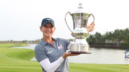 Bailey Tardy with the Blue Bay LPGA trophy