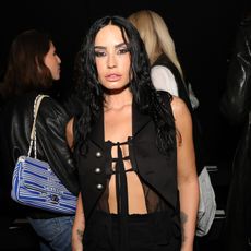a woman with long dark hair pictured at a party