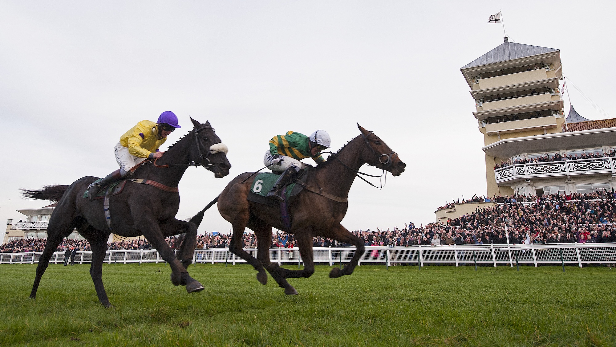 AP McCoy celebrates his 4,000th victory as he crosses the winning line on Mountain Tunes just beating Kris Spin in the 5th race during racing at Towcester racecourse on November 7th 2013 in Northamptonshire (Photo by Tom Jenkins)