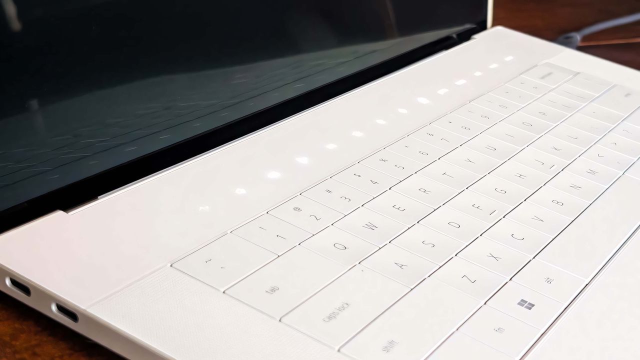 A closeup of the Dell 16 Premium's capacitive buttons above the keyboard.