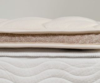 Close up on the layers in the Saatva Organic Quilted Mattress Topper.