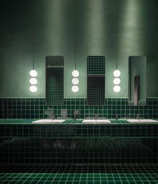 Green tiled bathroom of Taoxichuan Hotel in China by David Chipperfield Architects.