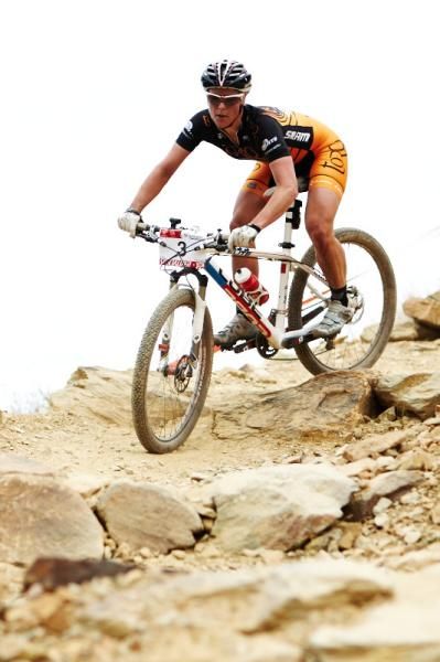 Katherine O'Shea takles a comanding lead and charges the downhill section in the Womens XC