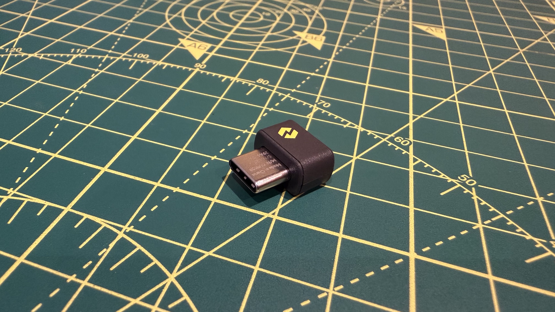 The Logitech MX Master 4 mouse on a graphing grid