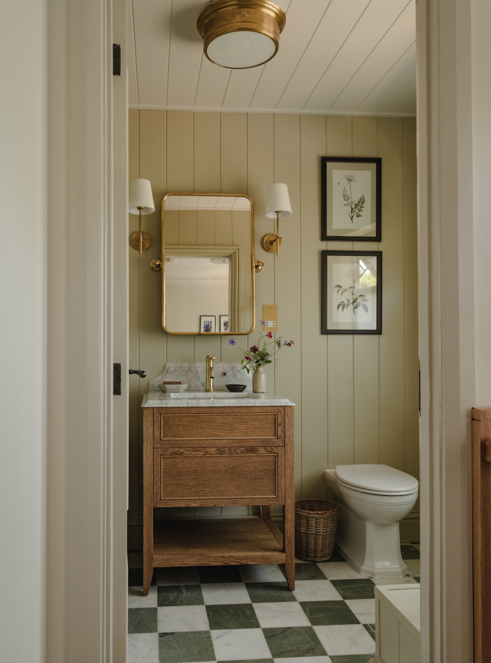 olive green bathroom with green checked floor tiles