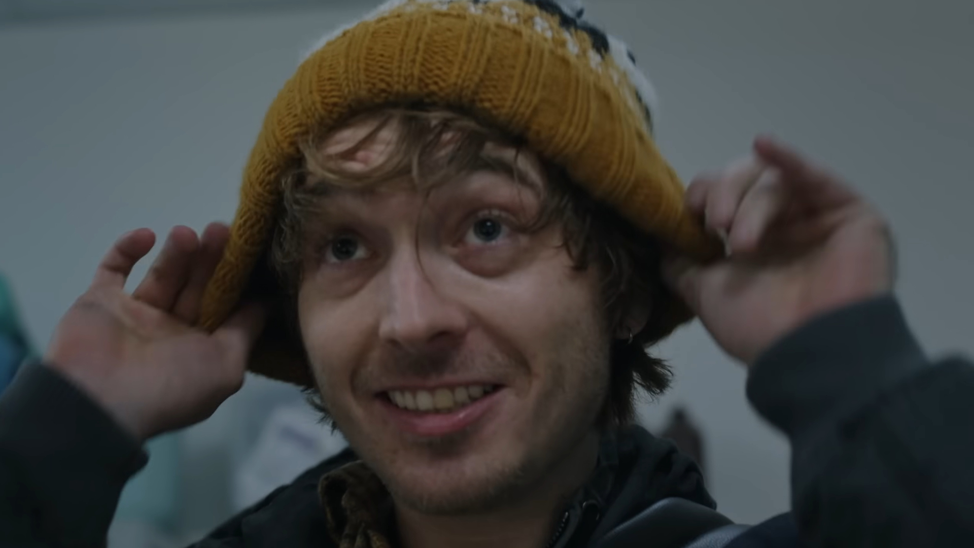 Bryan from Resident Evil putting on a hat