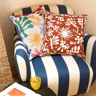 Casa RIXO collection cushions on blue and white sofa