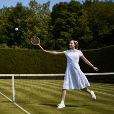 Female model playing tennis