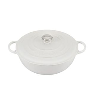 A white circular ceramic Le Creuset dutch oven