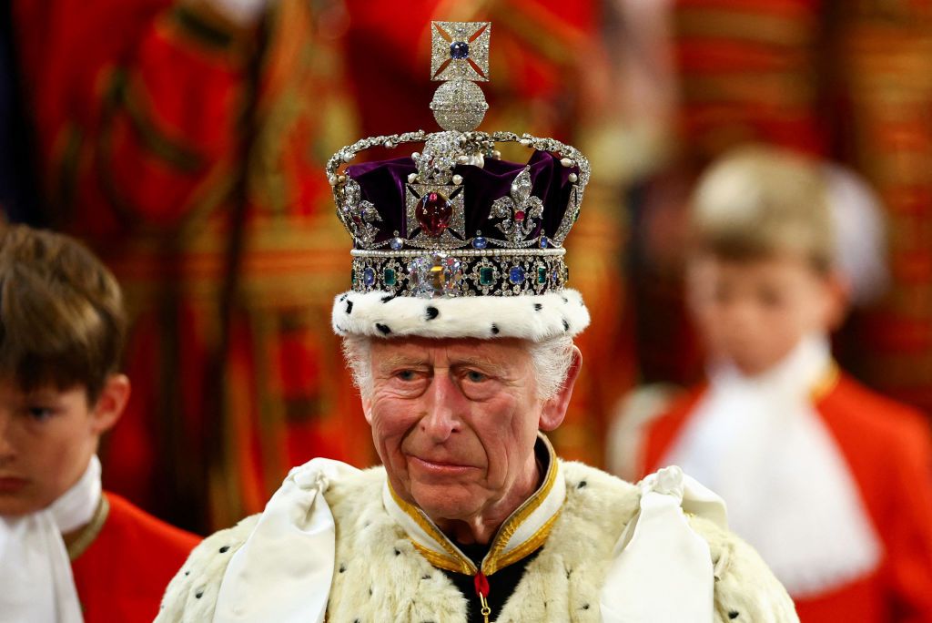 King Charles III wearing the Imperial State Crown and the Robe of State