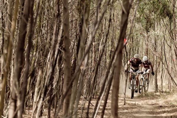 Werner Leitner and Swen Sundberg of Team Abu Dhabi Triathlon wind through singletrack