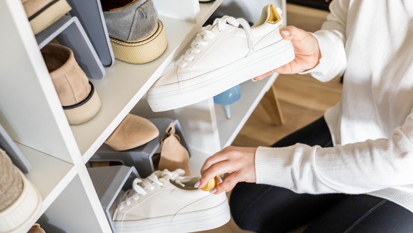 Woman tidying shoes