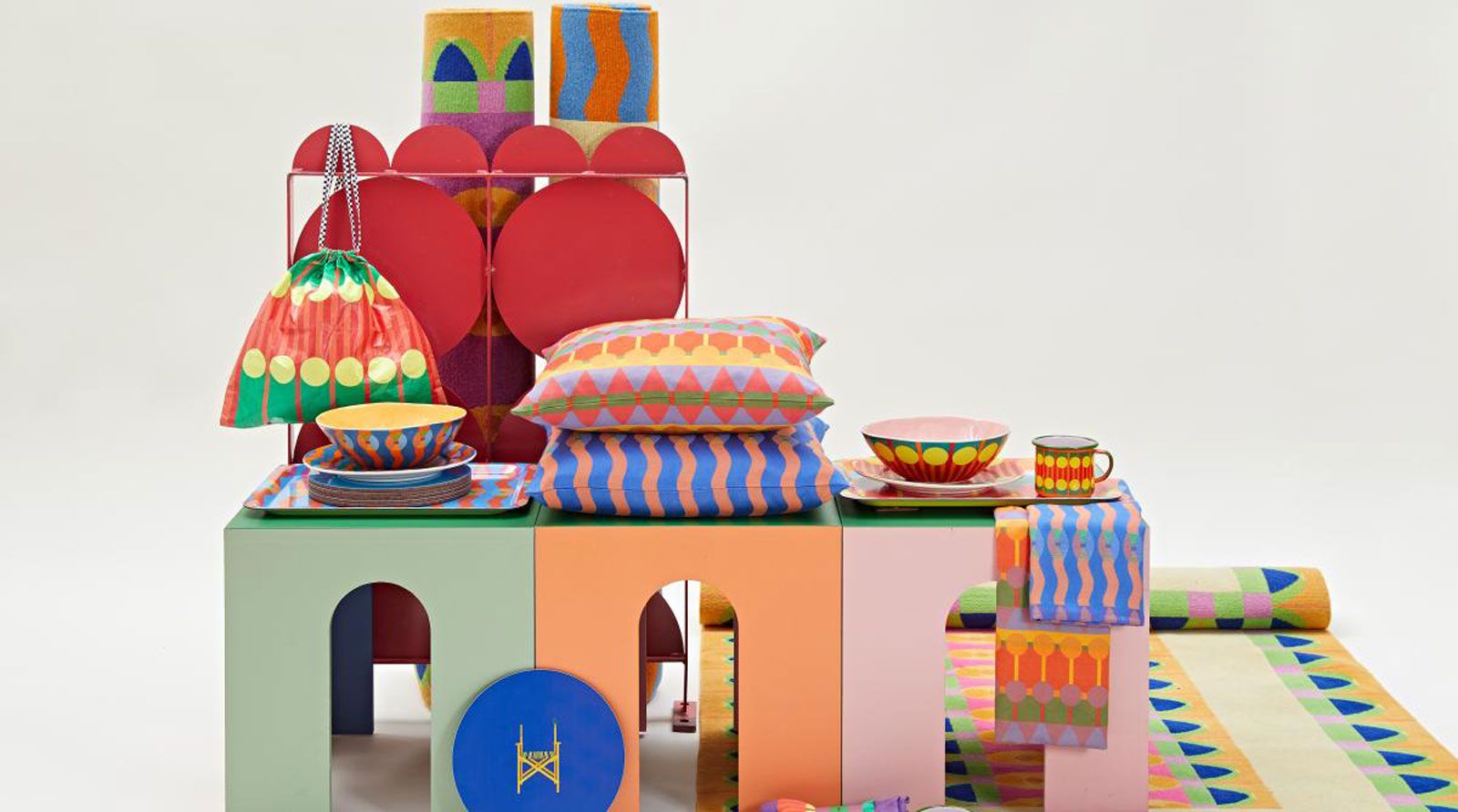 Colourful picnic blankets and cushions