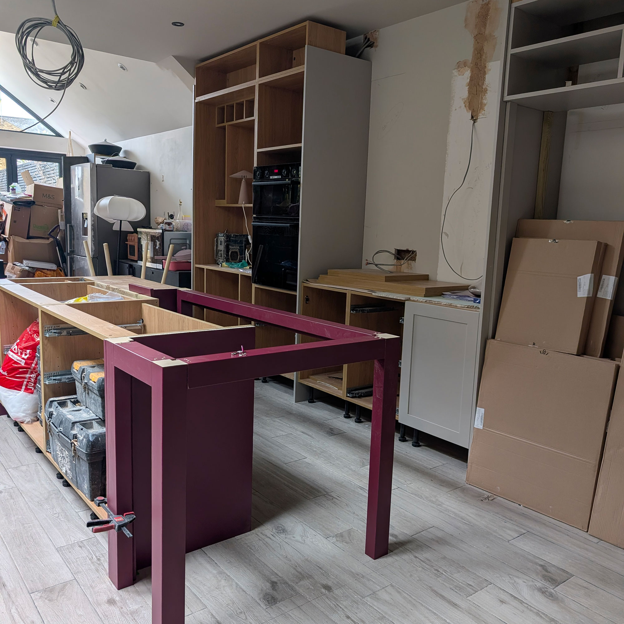 Kitchen mid-renovation, with cabinetry and island halfway through being built
