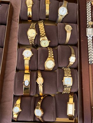 A velvet tray of vintage yellow gold Seiko watches.