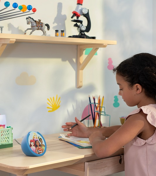 An Amazon Echo Pop Kids in a Disney Princess theme sitting on a desk.