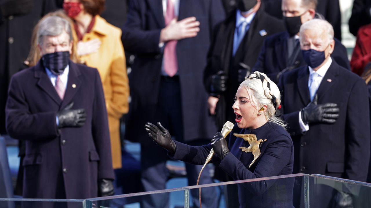 washington, dc january 20 lady gaga sings the national anthem at the inauguration of us president elect joe biden on the west front of the us capitol on january 20, 2021 in washington, dc during todays inauguration ceremony joe biden becomes the 46th president of the united states photo by alex wonggetty images