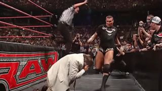 Randy Orton preparing to punt kick John Cena's dad