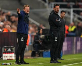 Newcastle head coach Eddie Howe (left) and assistant Jason Tindall on the touchline during the Premier League clash with Arsenal