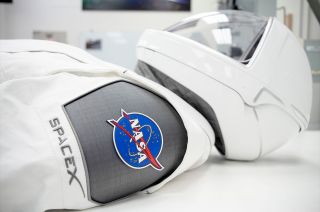 SpaceX’s new spacesuit, designed for use aboard its Crew Dragon spacecraft, features a sleek design with no exposed connectors or hardware and a helmet with 3D-printed components.