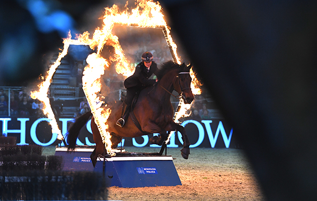 A well-deserved standing ovation: keeping the streets of London safe by day, the Metropolitan Mounted Police wow the crowds at Olympia with their activity ride
