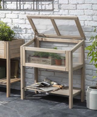 wooden raised cold frame on patio Garden Trading