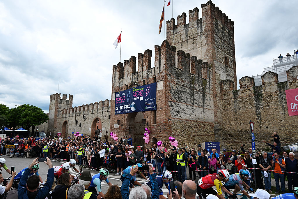 VICENZA ITALY MAY 23 Lorenzo Fortunato of Italy and Team XDS Astana Blue Mountain Jersey and a general view of the peloton passing through Soave Village during the 108th Giro dItalia 2025 Stage 13 a 180km stage from Rovigo to Vicenza UCIWT on May 23 2025 in Vicenza Italy Photo by Tim de WaeleGetty Images
