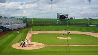 A hitter batting at Field of Dreams Ballpark. 