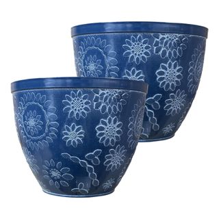 Pack of two blue plant pots with floral designs on them on a white background