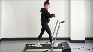 Image of woman walking on the Bluefin Fitness Task 2.0 Treadmill
