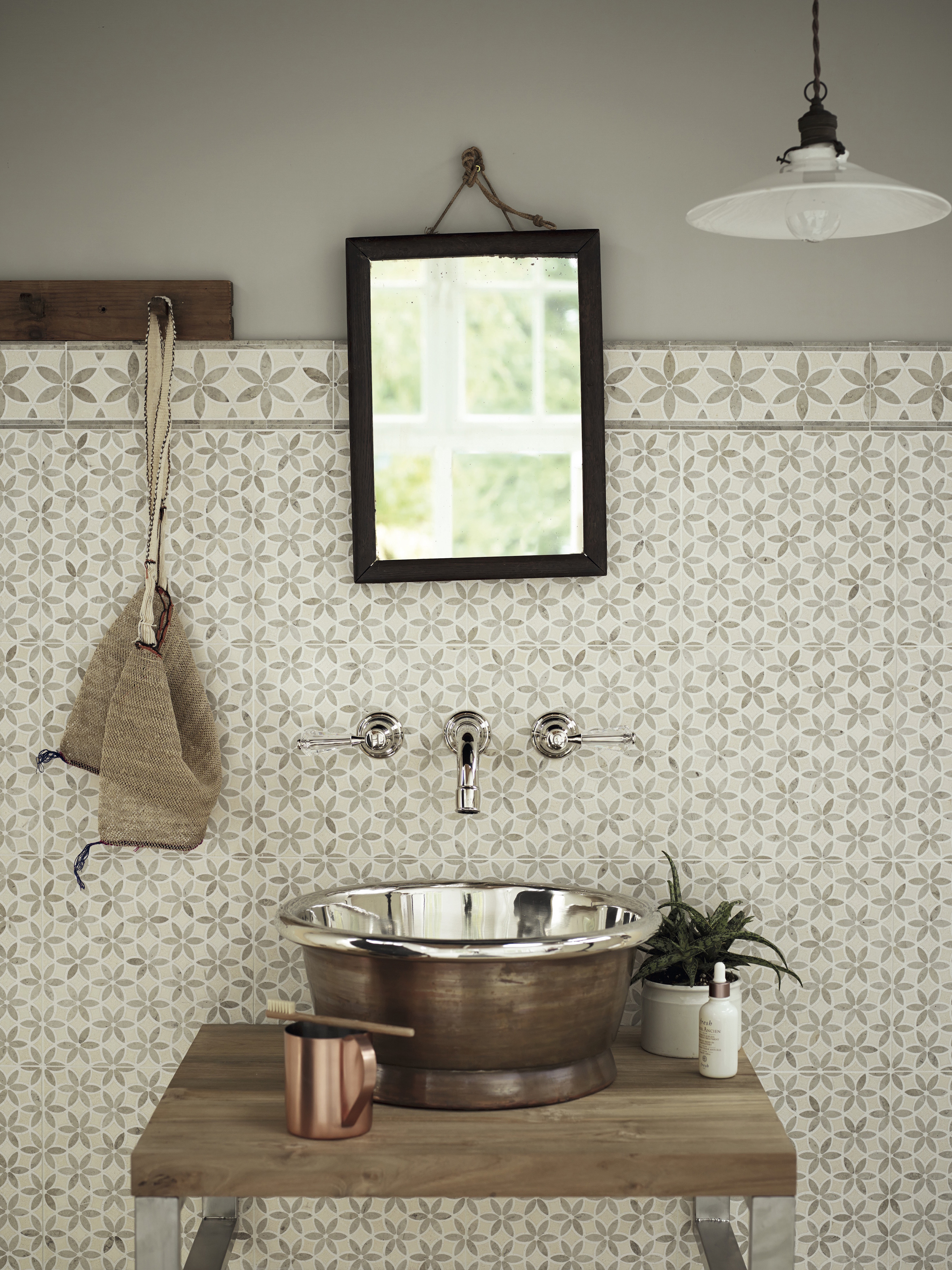 bathroom sink with floral motif tiles