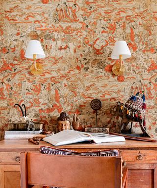 orange patterned wallpaper in a home office